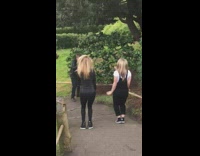 Two girls tiktok dance park walkway dad 