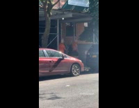 Guys walk on street wears penis headdress