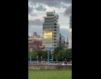 Collab WINY - Man sits on top of pull up bar 