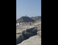 Two women white shirt tiktok dance beach hut