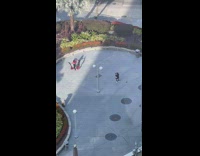 Girl spin around black red flags dome