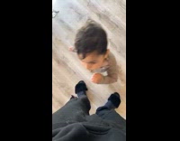 Man grabs son by shirt 