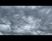 Wavy dark clouds form in the sky