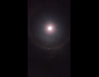 Submitter films night rainbow around the moon