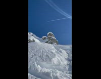 Skiier flips from cliff and lands 