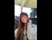 Girl with open mouth smiles and dances 