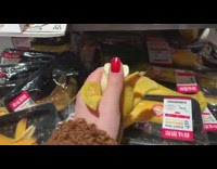 Girl squishes banana and mango toys 