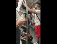 Guy does tricks on metal bars in subway