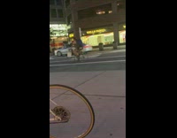 Guy talks into white megaphone bicycle street 
