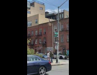 Two guys rooftop lift table up rope 