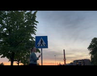 Lady Looks then Walks Across Flooded Street