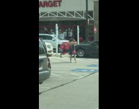 Old man sit convertible car hug penguin