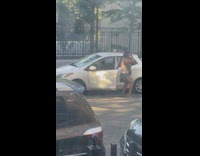 Lady dances alone before getting into car 