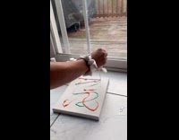 Girl makes a painting with her dog