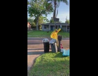 Two guys yellow hazmat suit checks mail