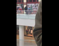 Woman blue sweater violet skirt spin mall