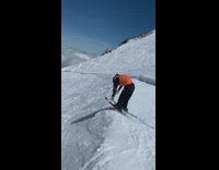 Guy wearing skis tries to do front flip fail 