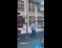 Collab WINY - Man in purple with sunglasses dances beside band on the stage