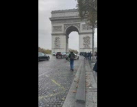 People on road take pictures with arc