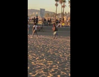 Woman pink hair green outfit fall skateboard 