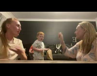 Girl and mom plays rock, paper, scissors