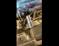 Guy drops metal tool into car falls to ground 