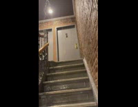 Water flows down the stairs of apartment complex 