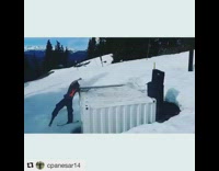 guy grey shirt skiing lands on metal box