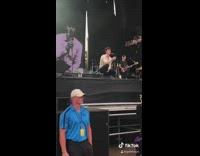 Blue shirt security guy laughs Shawn Mendes