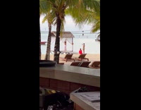 Woman in white dress walk towards the hut
