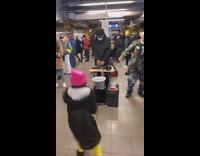 Little girl and old man dance to man playing music