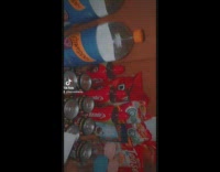 Girls mix alcohol and fruit in container