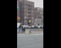 Man in Unicycle Turns and Crosses Street Intersection