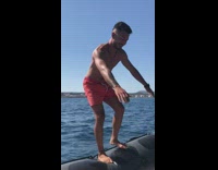 Red shorts guy backflips  inflatable boat water