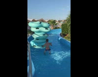 Man inside the stack of floaters at the pool
