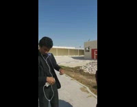 Teenage boy gets spit on with water by classmate 