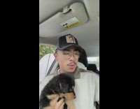 Guy shows backpack he got for puppy