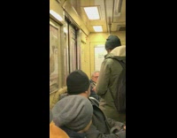 Guy uses arm to stop subway door