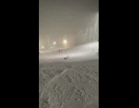 Snowboarder yellow pants jump fail