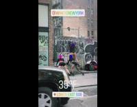 Three girls wearing ski masks twerk fence