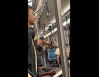 Man shirtless dances inside the subway train