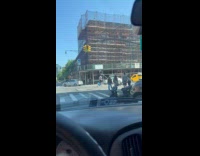 Man ride bike with tire on head