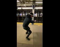 Guy plays VR in subway 