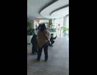 Girl poses one leg up hotel lobby