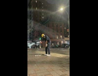 Man golfs small boxes at night then chases one