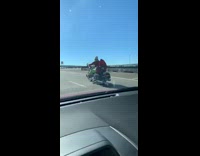 BitchMP - Grinch driving riding motorcycle down freeway