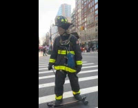 Firefighter ride electric skateboard on the street