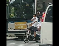 White shirt guy bicycle rickshaw couple bus
