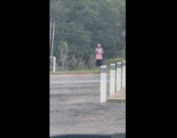 Guy pink cap top livestream parking lot