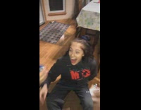 Friends trick girl with shot of water from sink